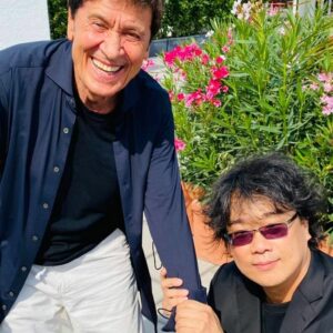 Venezia 78: l’incontro epico tra Gianni Morandi e Bong Joon-Ho